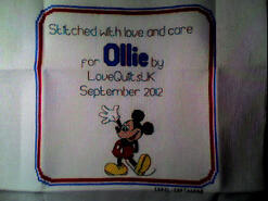Cross stitch square for Ollie E's quilt