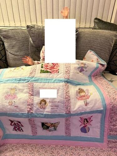 Photo of J As quilt