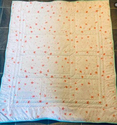 Photo of J As quilt